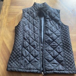 Black puffer vest.